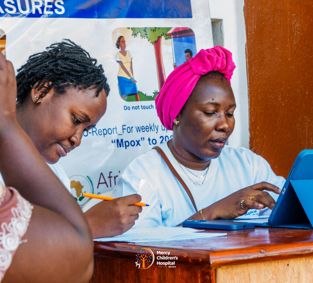 A staff member registering a family at the front desk