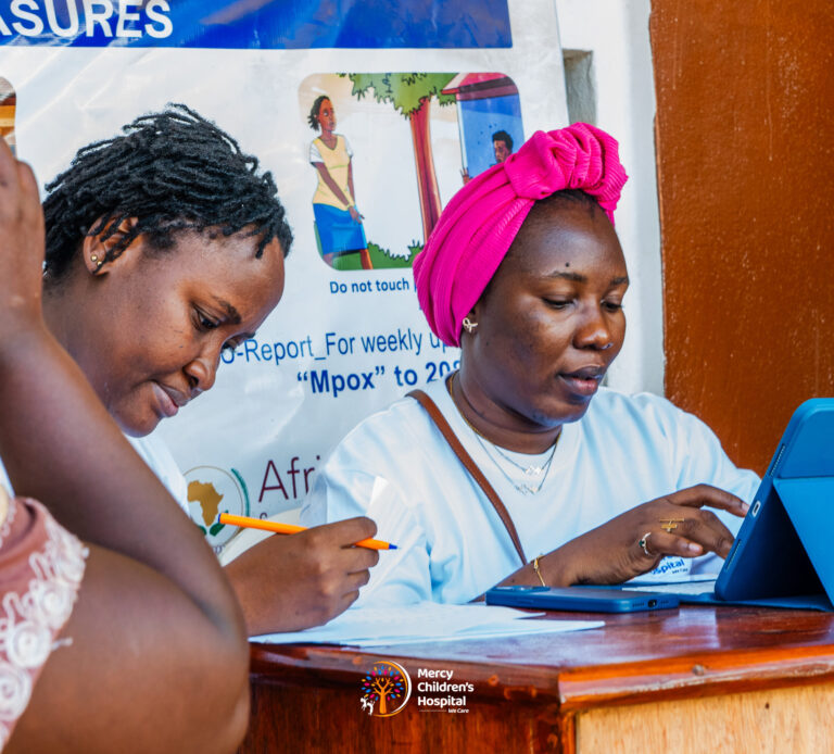 A staff member registering a family at the front desk